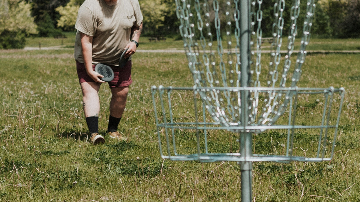 a man throwing a frisbee