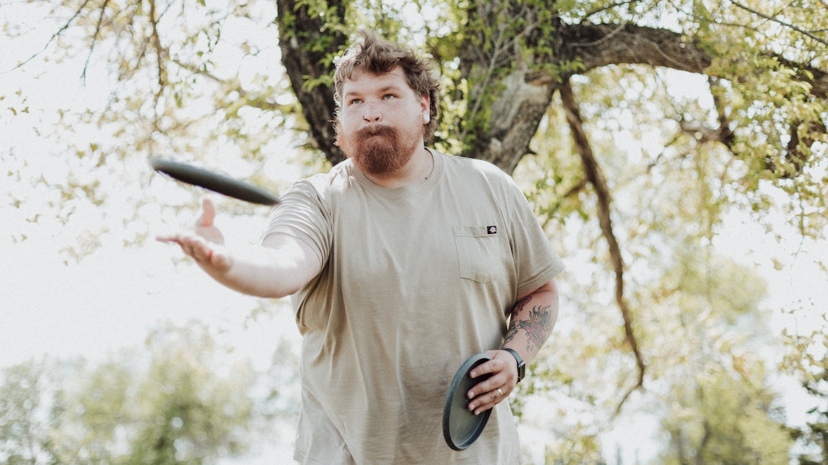 a man holding a frisbee