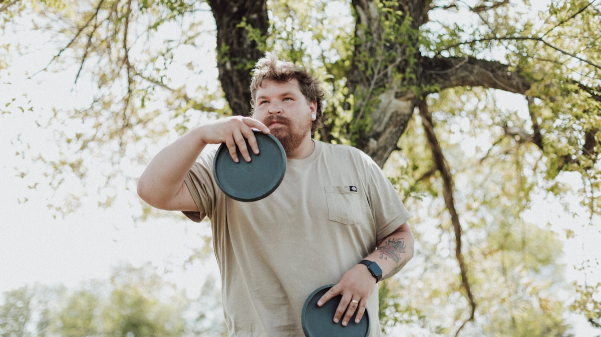 a man holding a frisbee