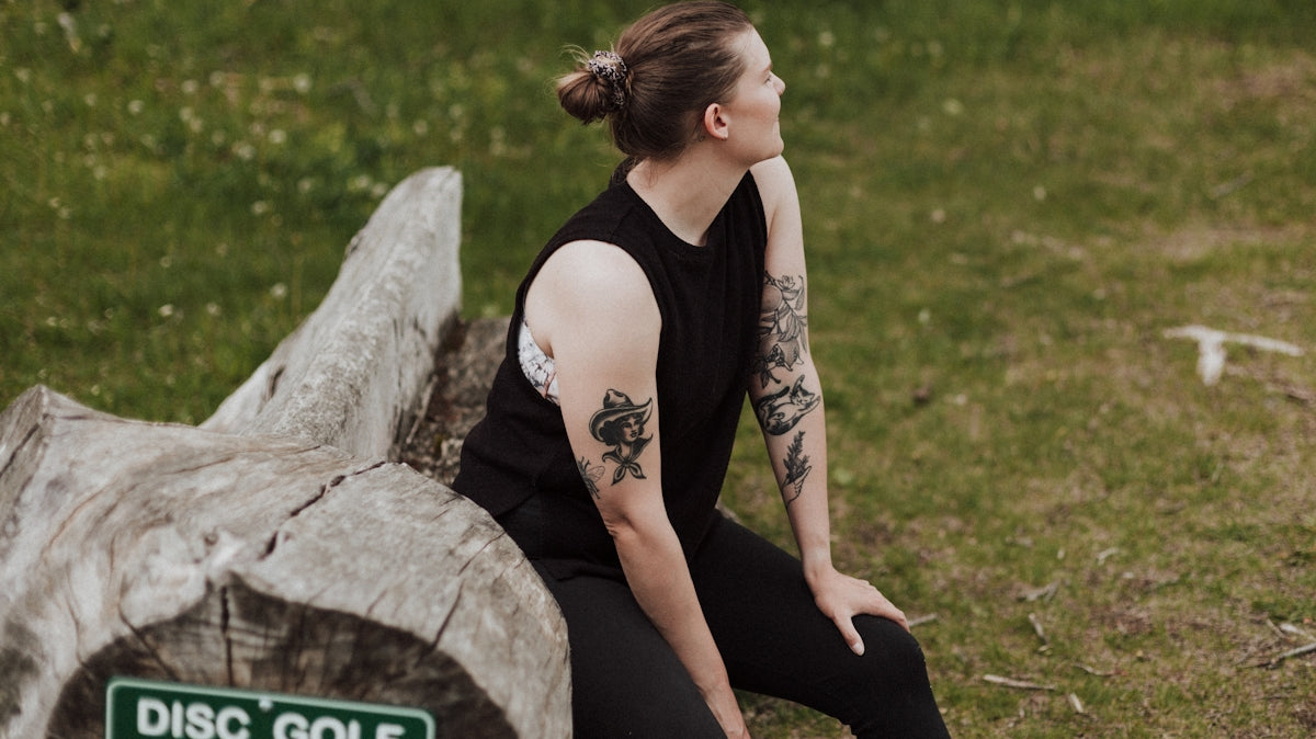 a person sitting on a rock