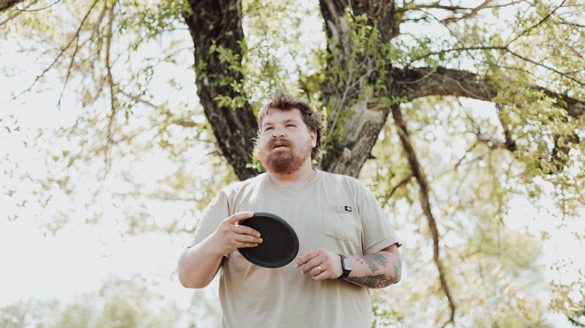 a man throwing a frisbee