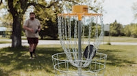 a person standing next to a goal