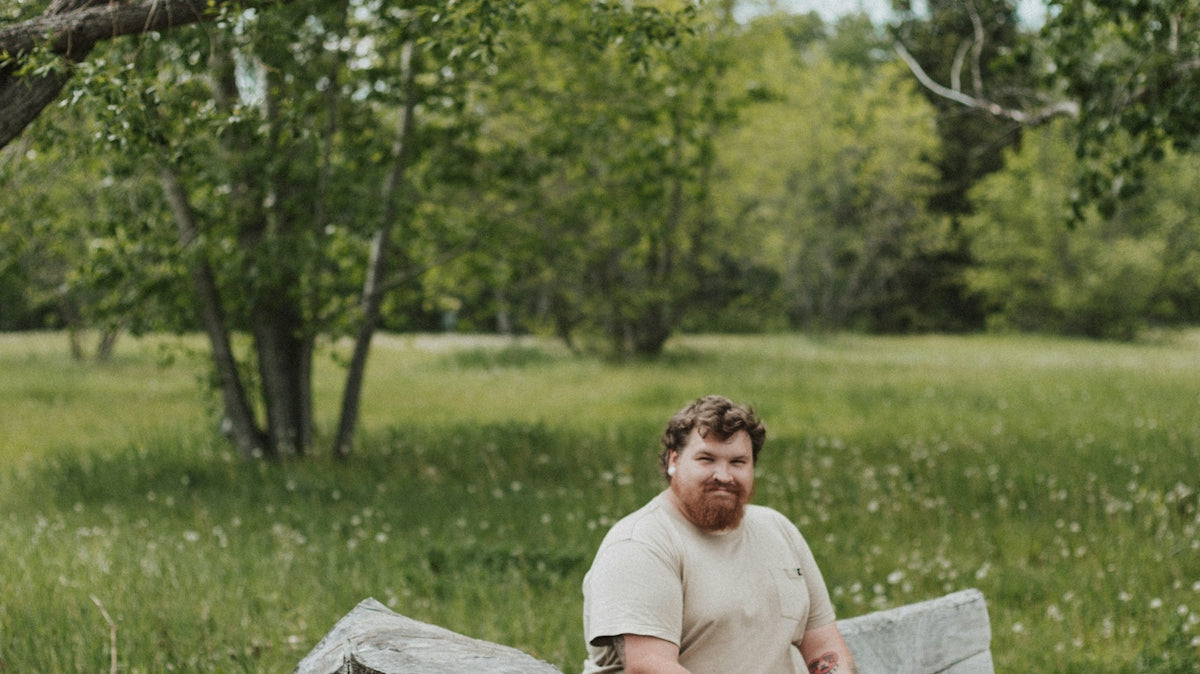 a man sitting on a log