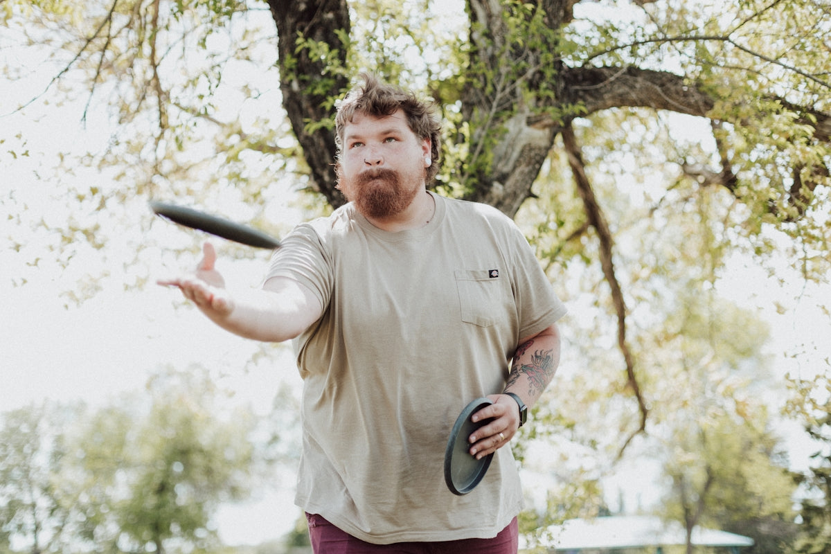 a man holding a frisbee