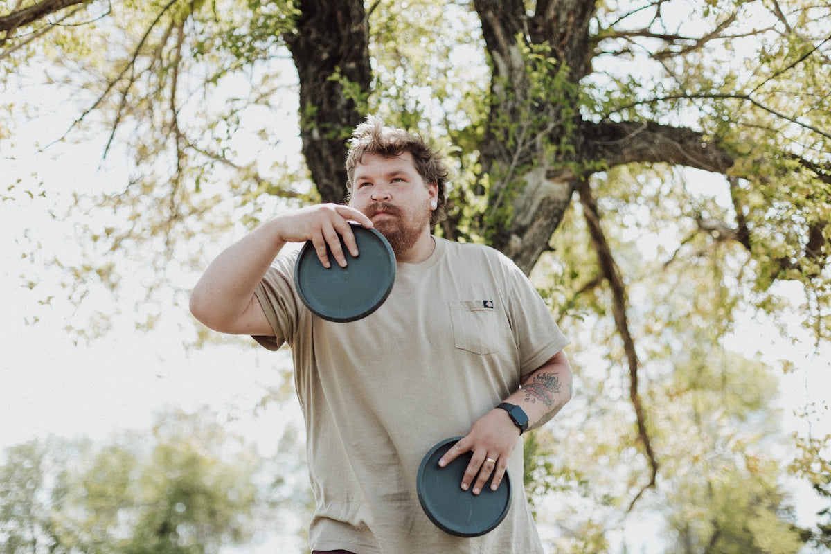 a man holding a frisbee
