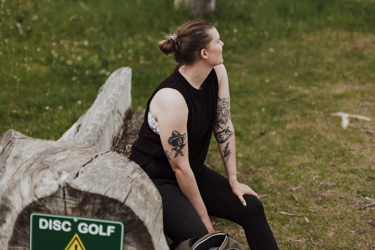 a person sitting on a rock